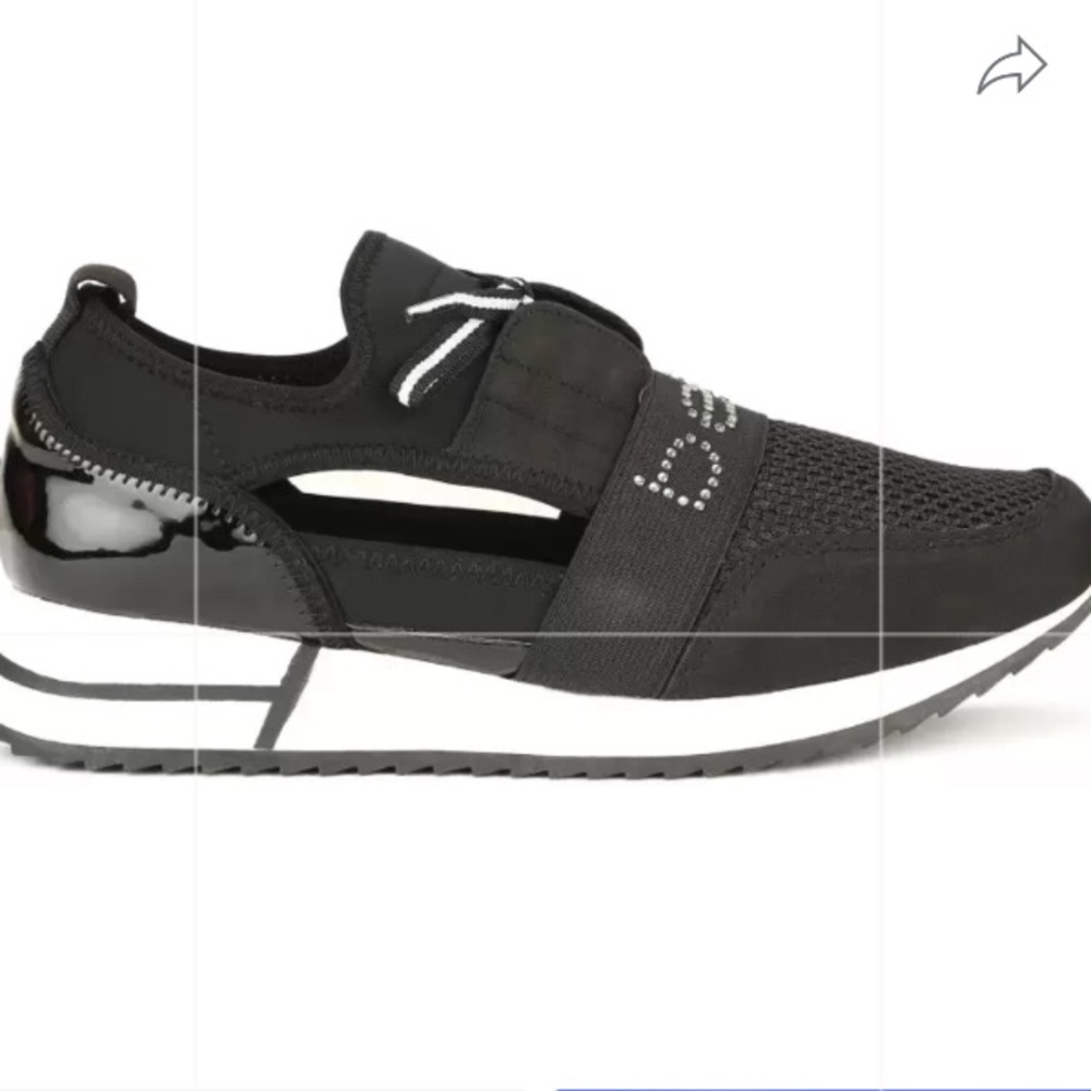 Bebe Brienne black sneakers with cut out on sides.